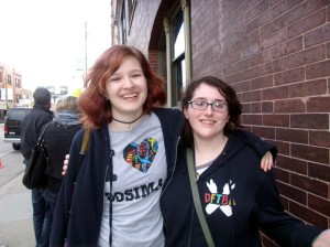 Two super cool ladies we met while standing in line. Note the clothing with the DFTBA slogans and Nerdfighter insignias. 